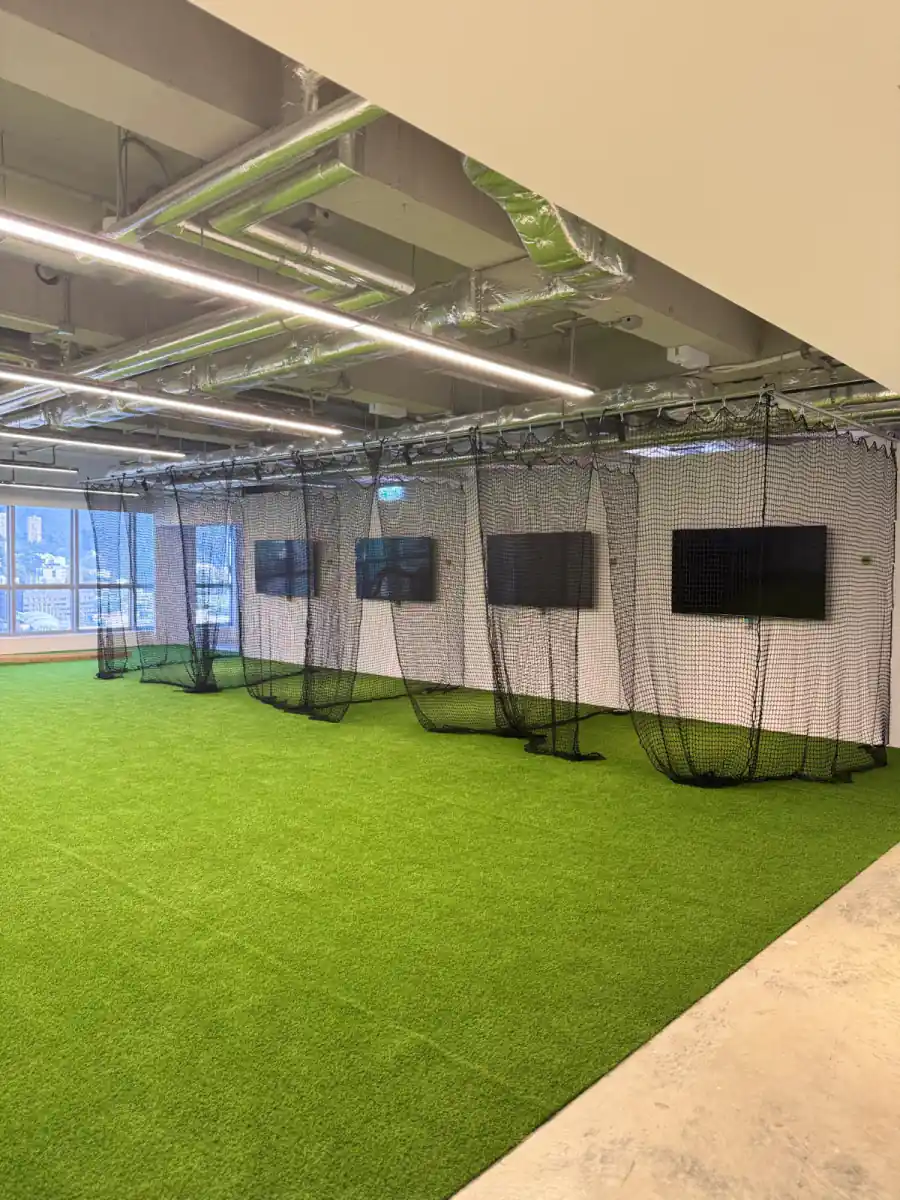 Netted batting and golf cage bays on the turf at MosKiddo