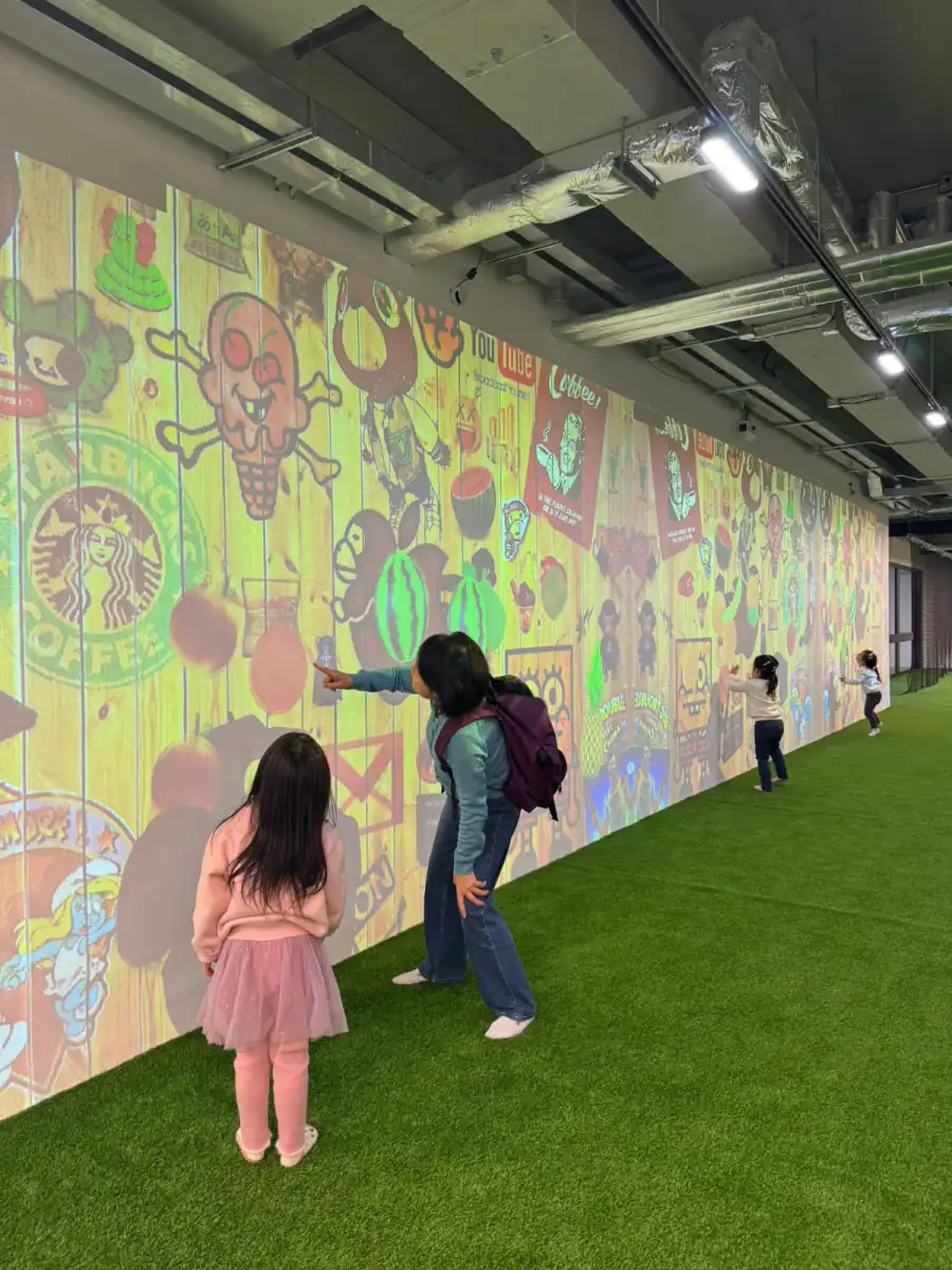 An interactive projection wall on the turf at MosKiddo